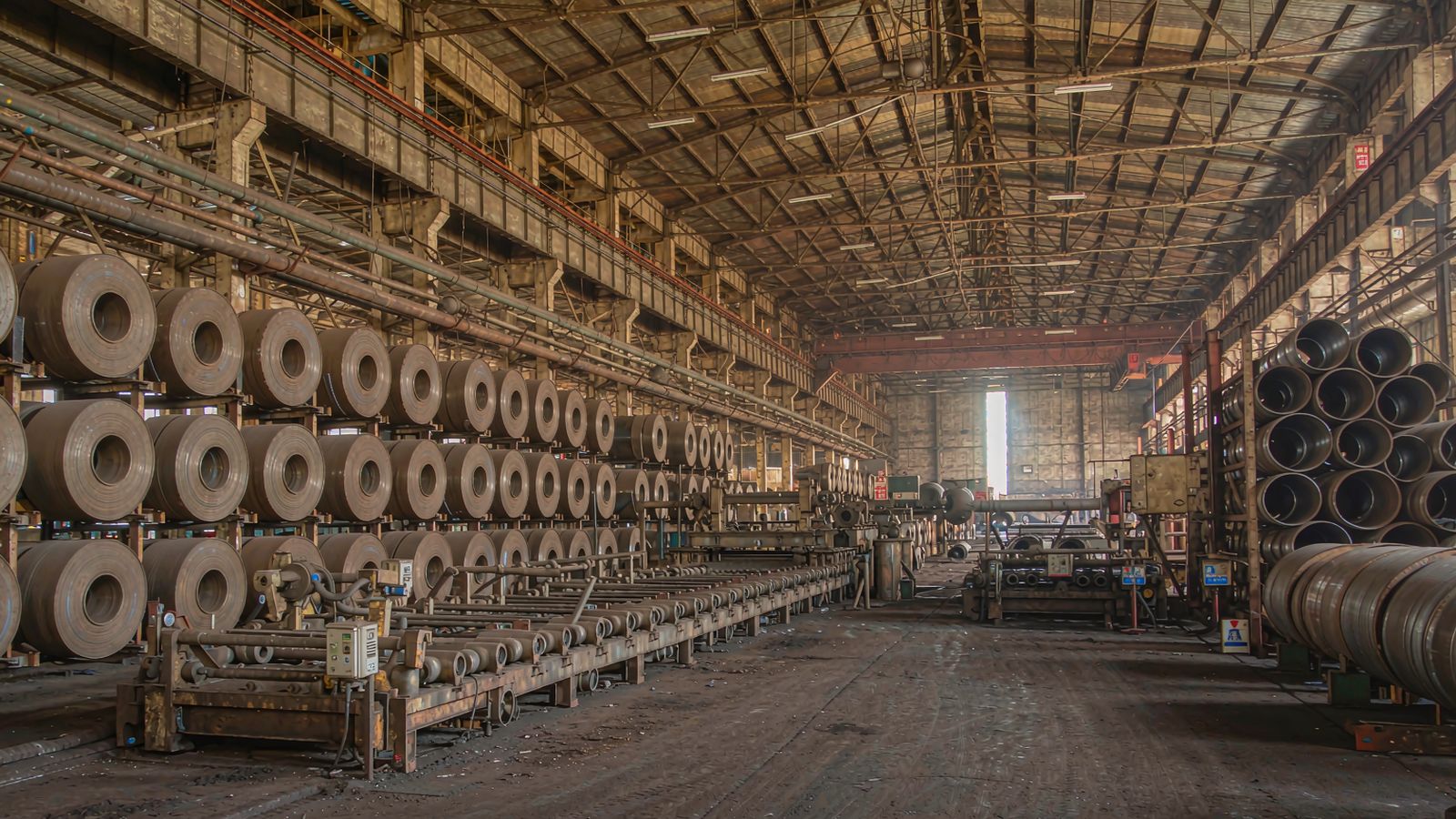 Steel factory workshop with steel coils and steel pipes